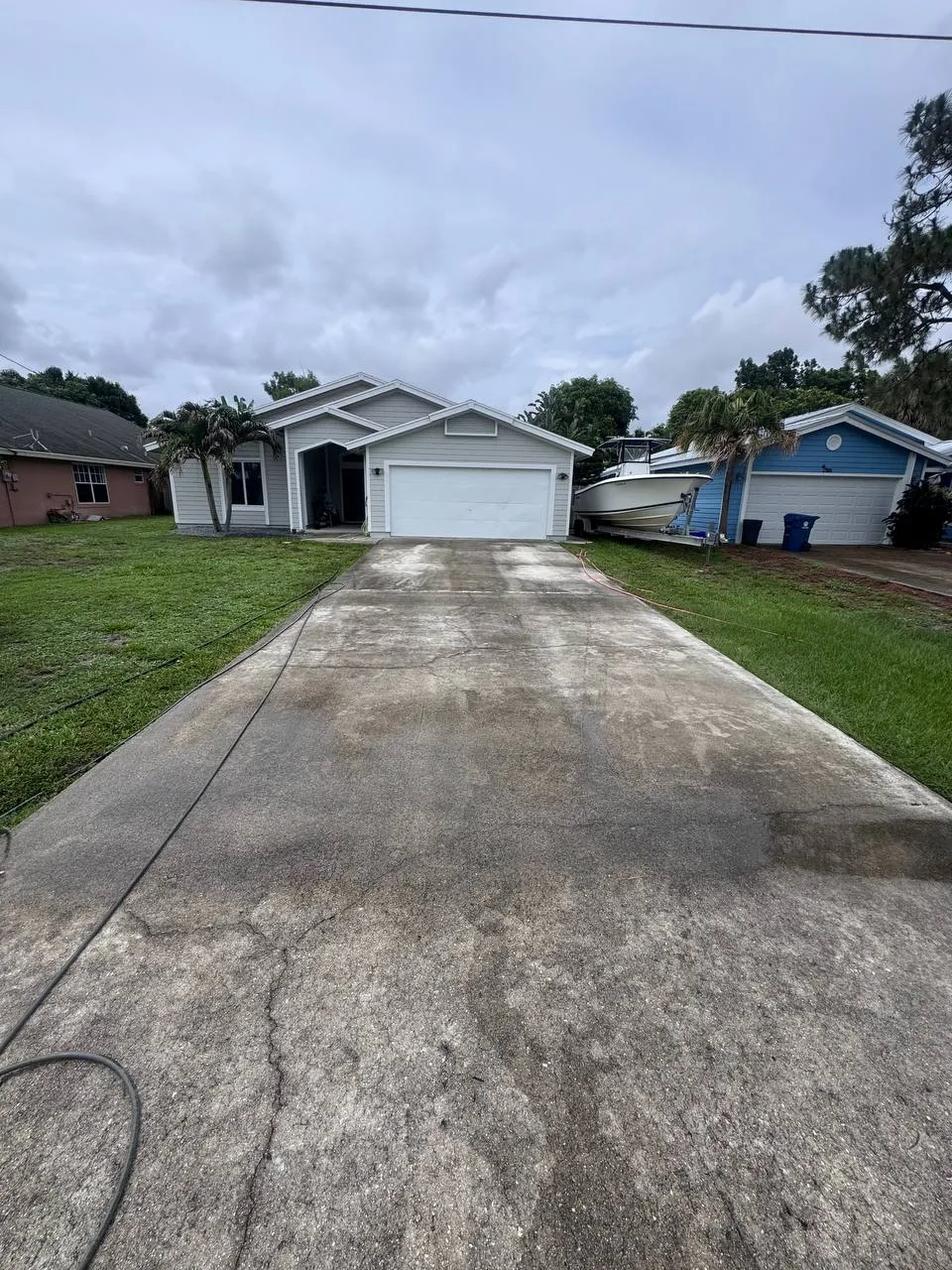 Concrete driveway pressure wash, before