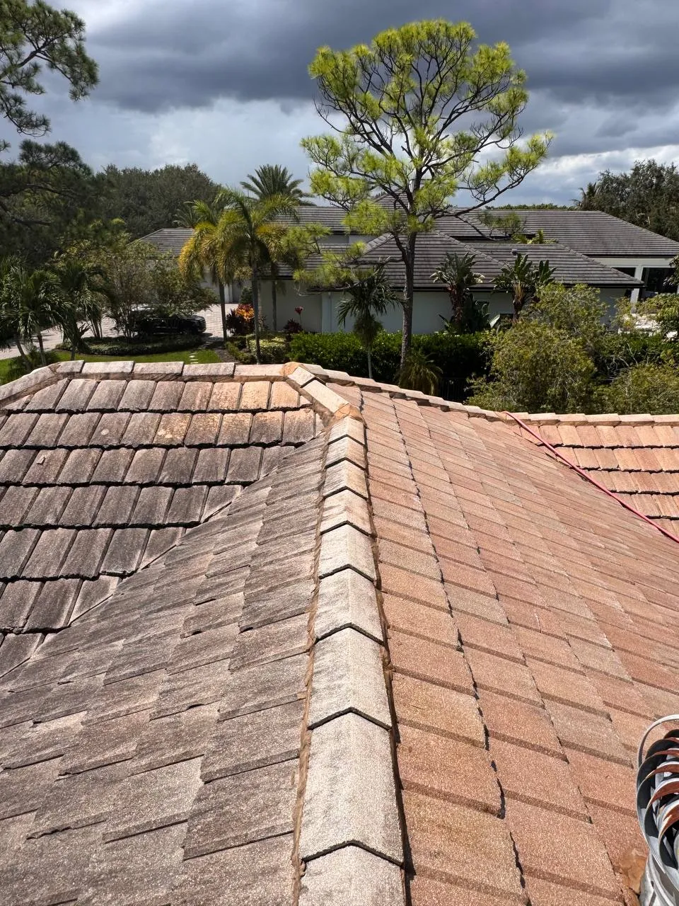 Flat tile roof, half cleaned
