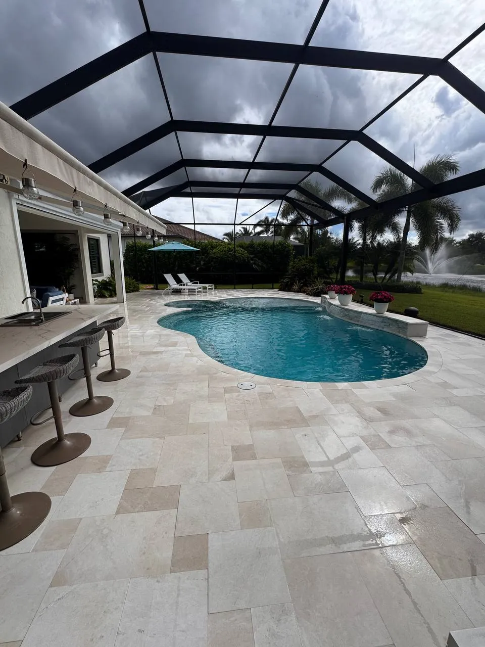 Travertine pool deck in Ancient Tree, Palm Beach Gardens