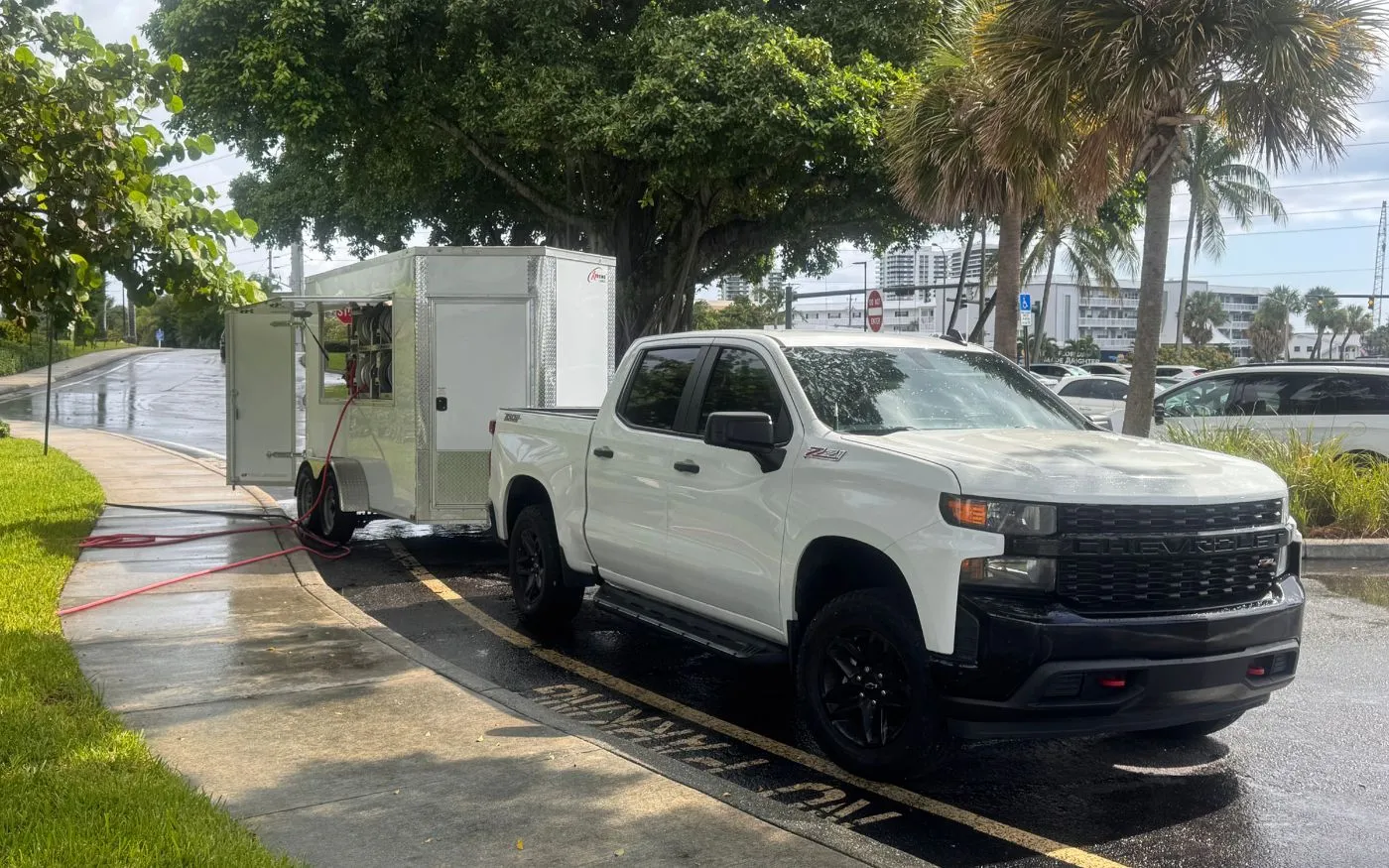 The Bergs truck and trailer parked at a job